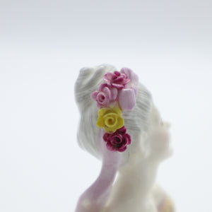 Handmade and hand painted porcelain figurine